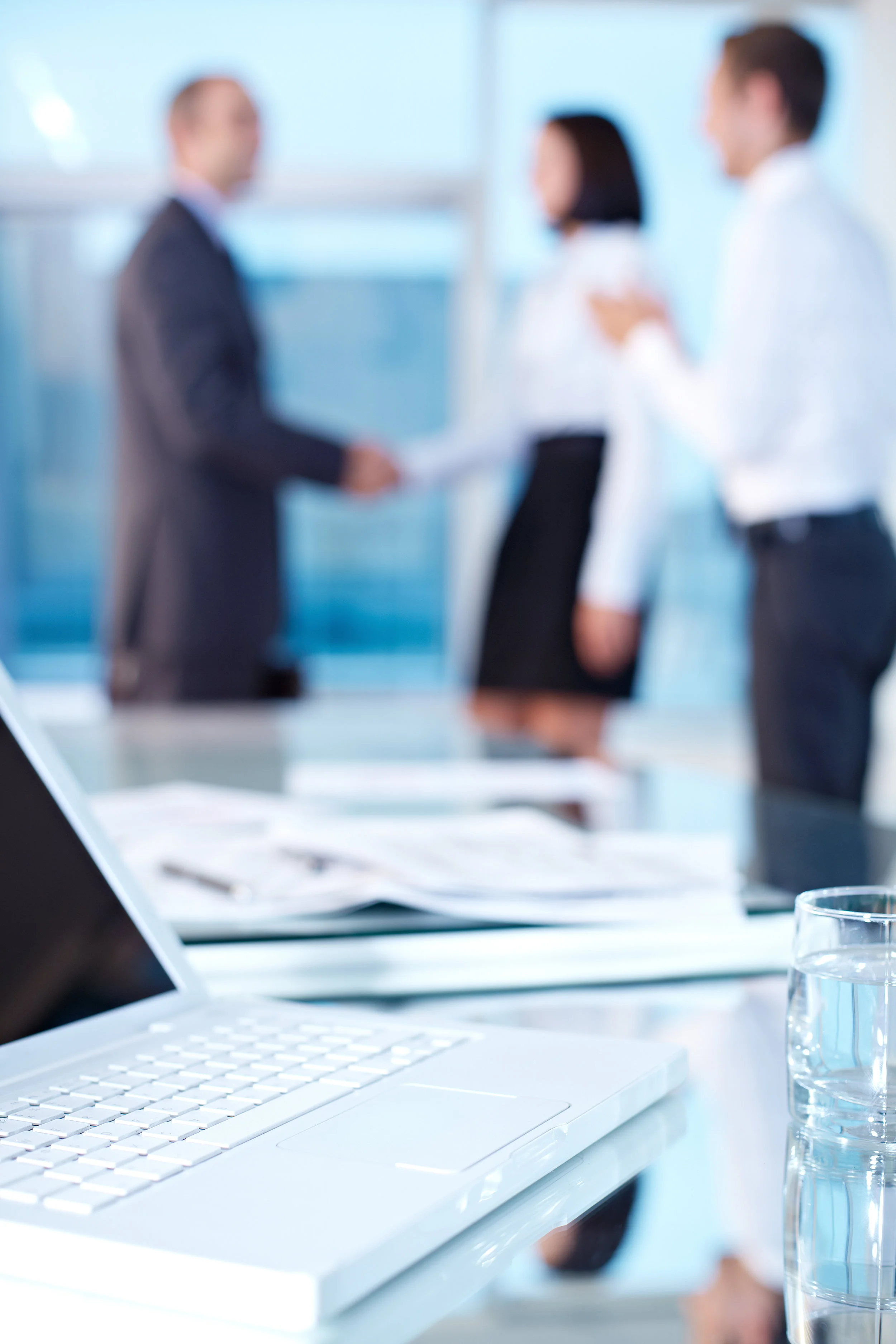 Blurred image of meeting + handshake.jpg