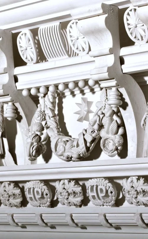 The swag detail is placed on a hinge and swings freely.