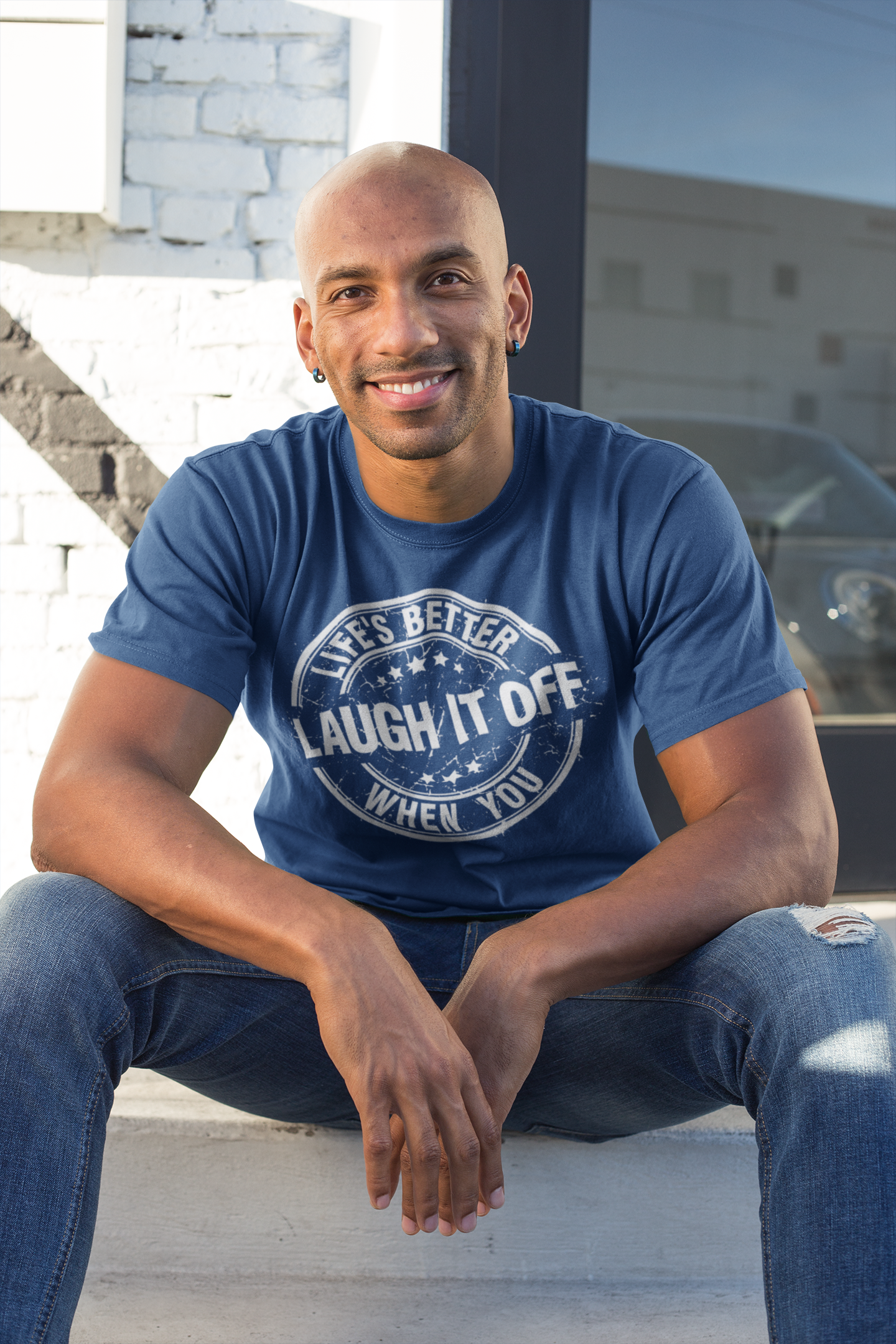 t-shirt-mockup-of-a-happy-man-sitting-on-a-stairway-18239.png