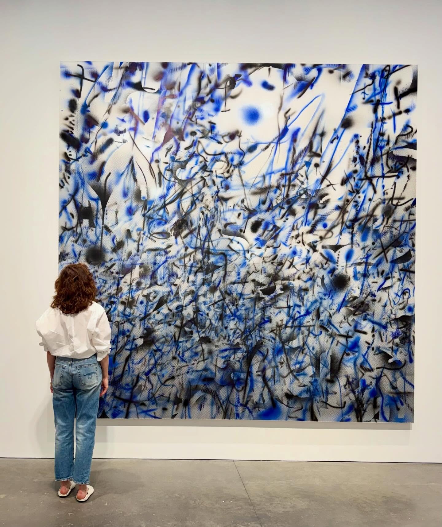 Standing in front of this painting makes me want to take up a baton and conduct the orchestra. This musical score of a painting is at once cacophonous and harmonious. I hear cymbals clash and horns blair, staccato noise and then a lull before the nex