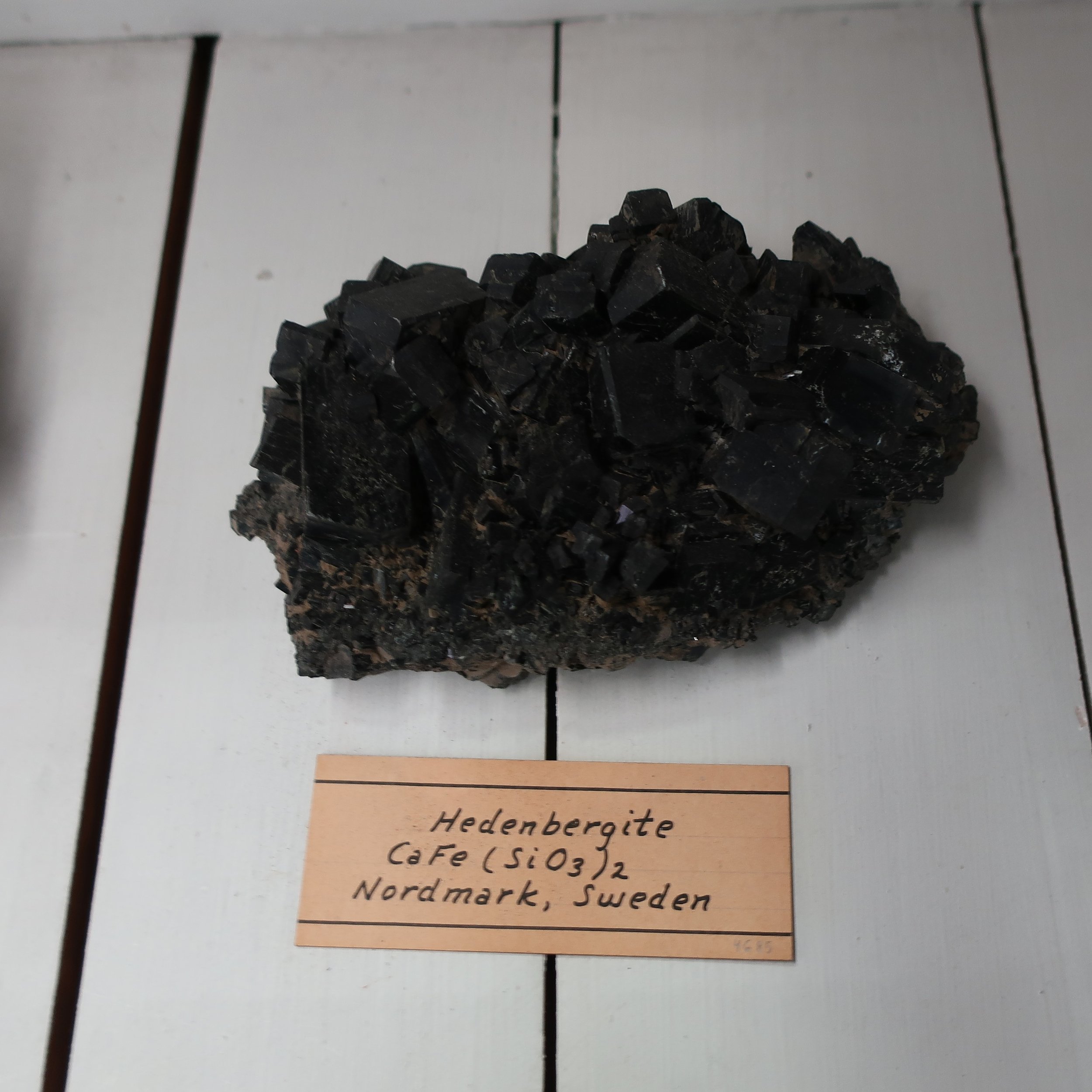   “Hedenbergite  is a variety of cocolite from Zuneburg in Sweeden, its chemical contents vary but little from the former species. it is named in honor of the Chemist Hedenburg, the French Mineralogist Beudant places several varieties under that name