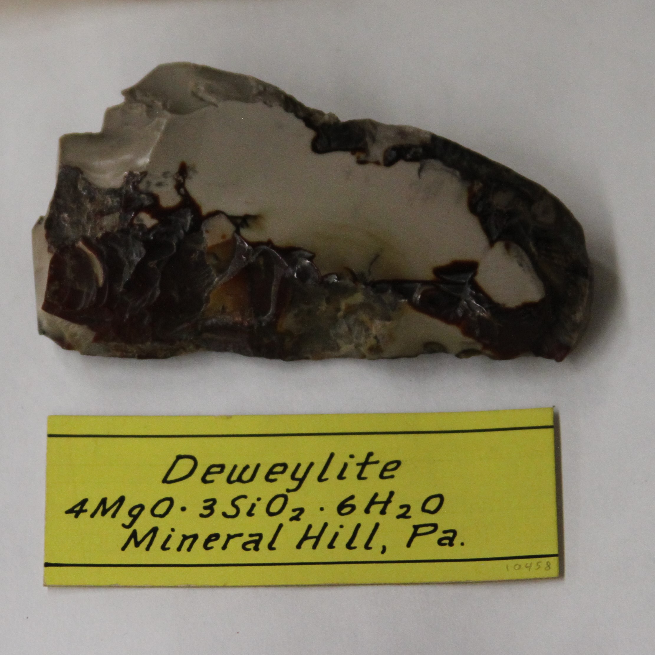   “Deweylite [ is a variety of Serpentine] found in seams and irregular veins in Middlefield, Massachusetts. It contains Magnesia 40, Silica 40, Water 20, Sp Gr 2.3. It is yellowish and greenish white, lustre is vitrious, inclining to resenous, easil