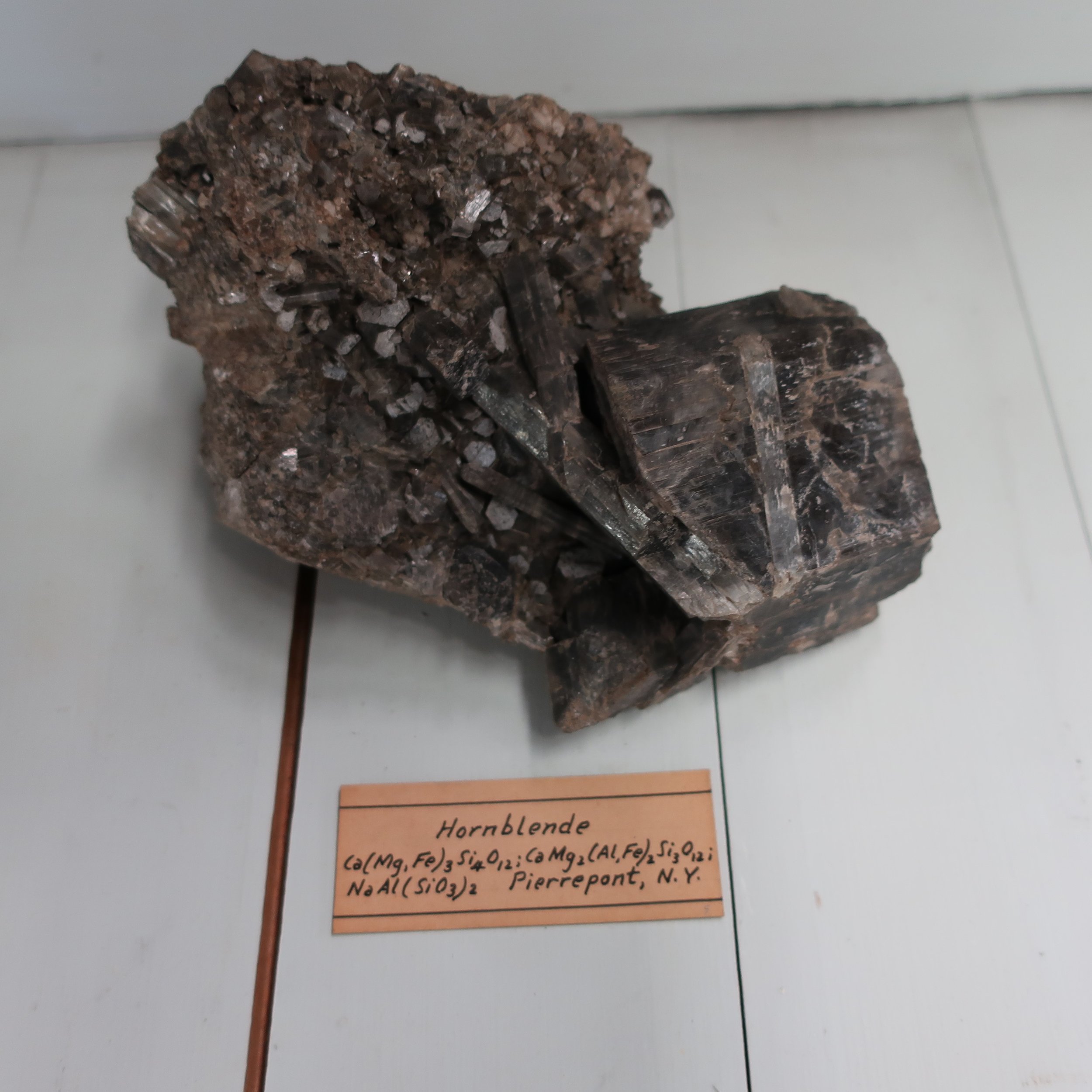   “Massive hornblende  has a crystalline structure, consisting of minute, and often of long crystals, intersecting each other, sometimes confusedly radiating. It is very tough, and difficult to break.” 