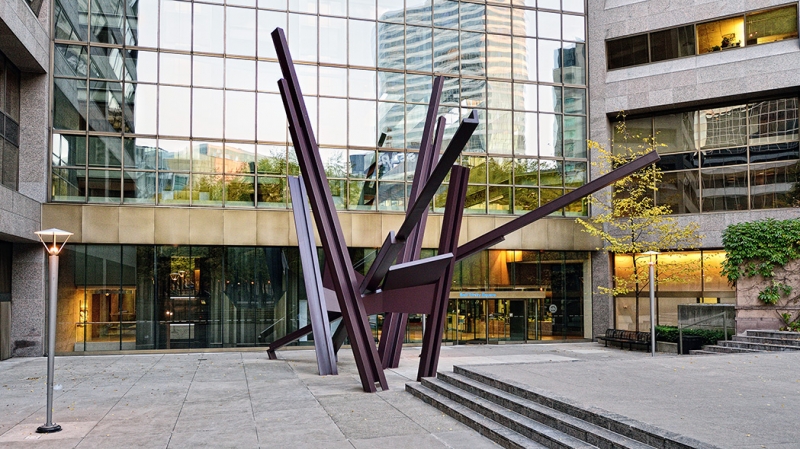 View of a modernist sculpture at the building entrance