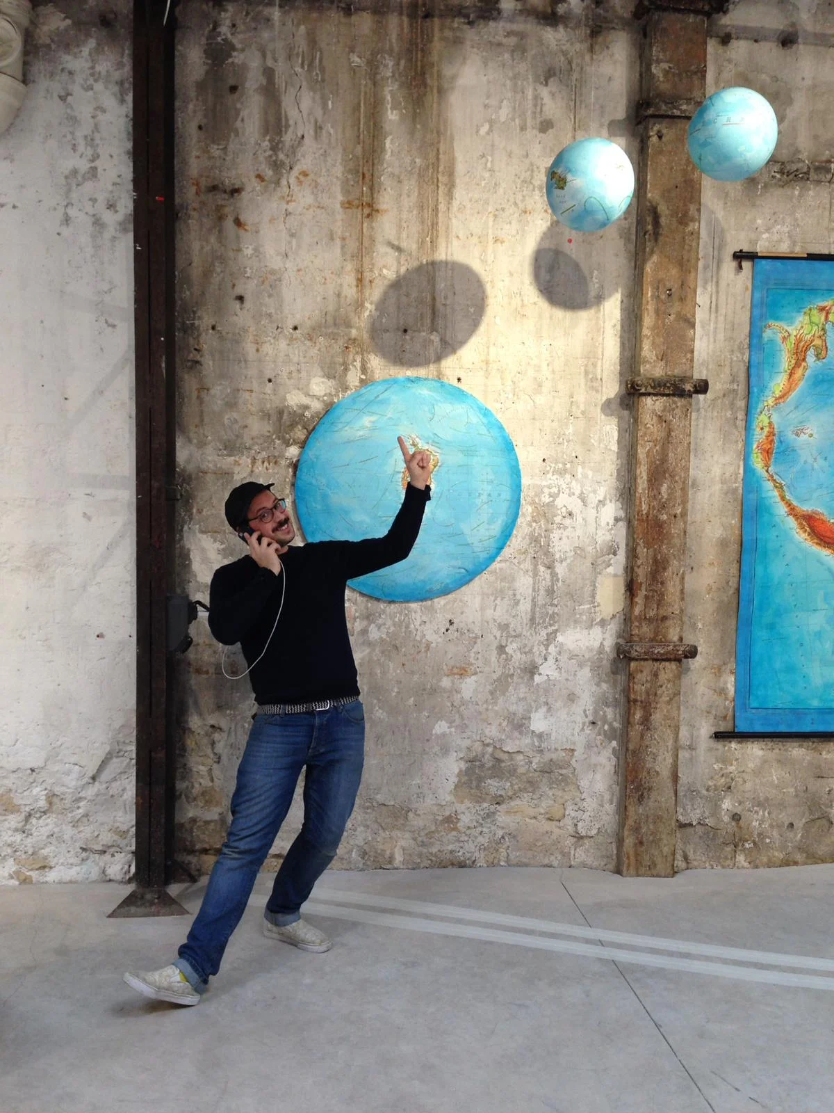 Curator Léo Marin showing the works of Cristina Barroso