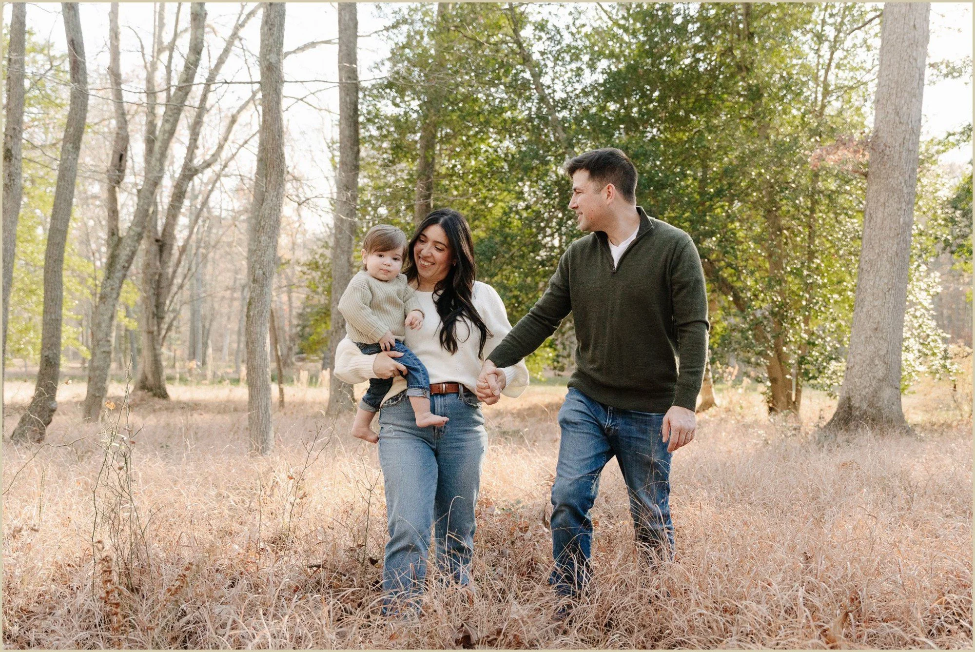 fall family photo session walking in a field