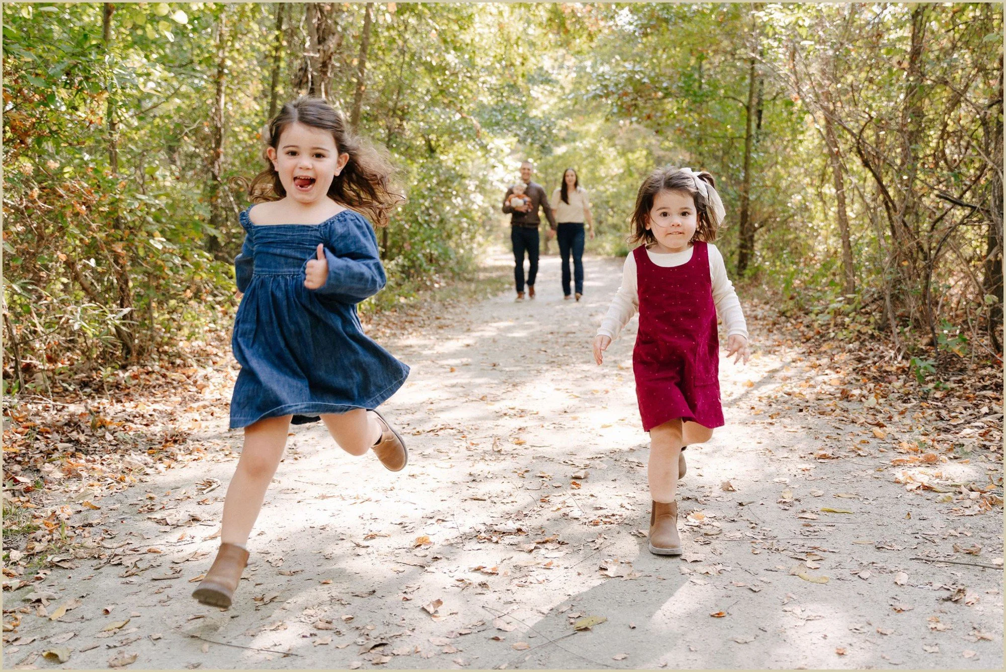 kids running ahead of parents fall holiday card photo session