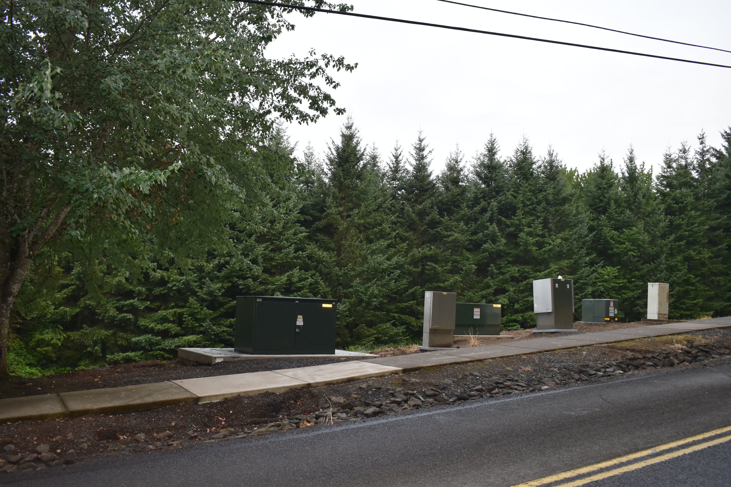  New electric boxes serving the undergounded lines sit on concrete pads.  