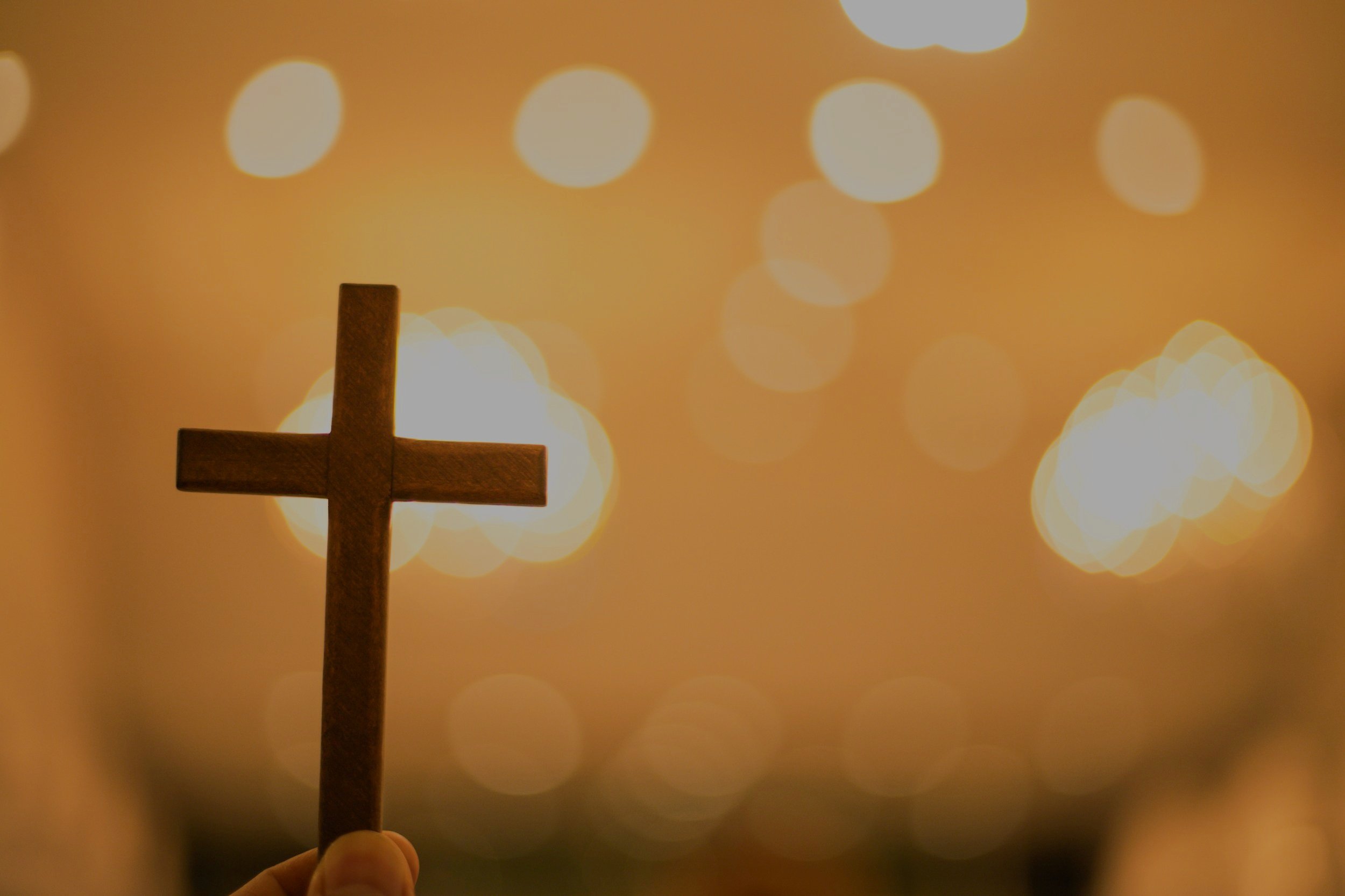 christian-cross-with-blurred-bokeh-background-light-at-church.jpg