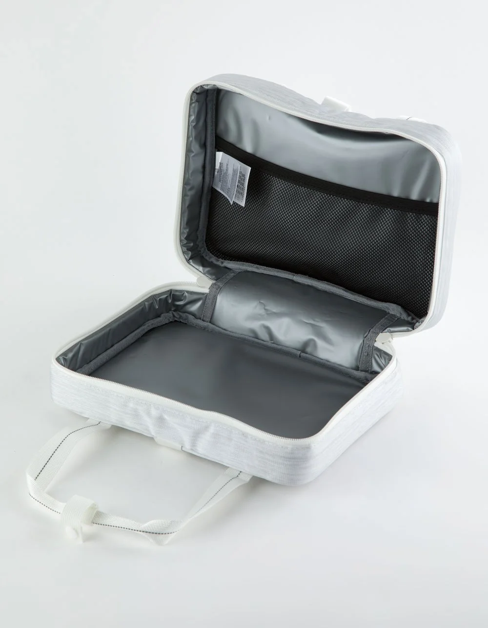 Open empty white travel organizer or toiletry bag with gray interior and black mesh pocket, on white background.