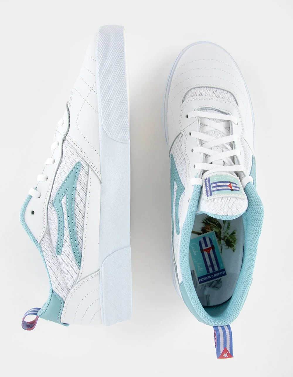 Pair of white sneakers with light blue accents and a striped heel tab, viewed from above on a white background.