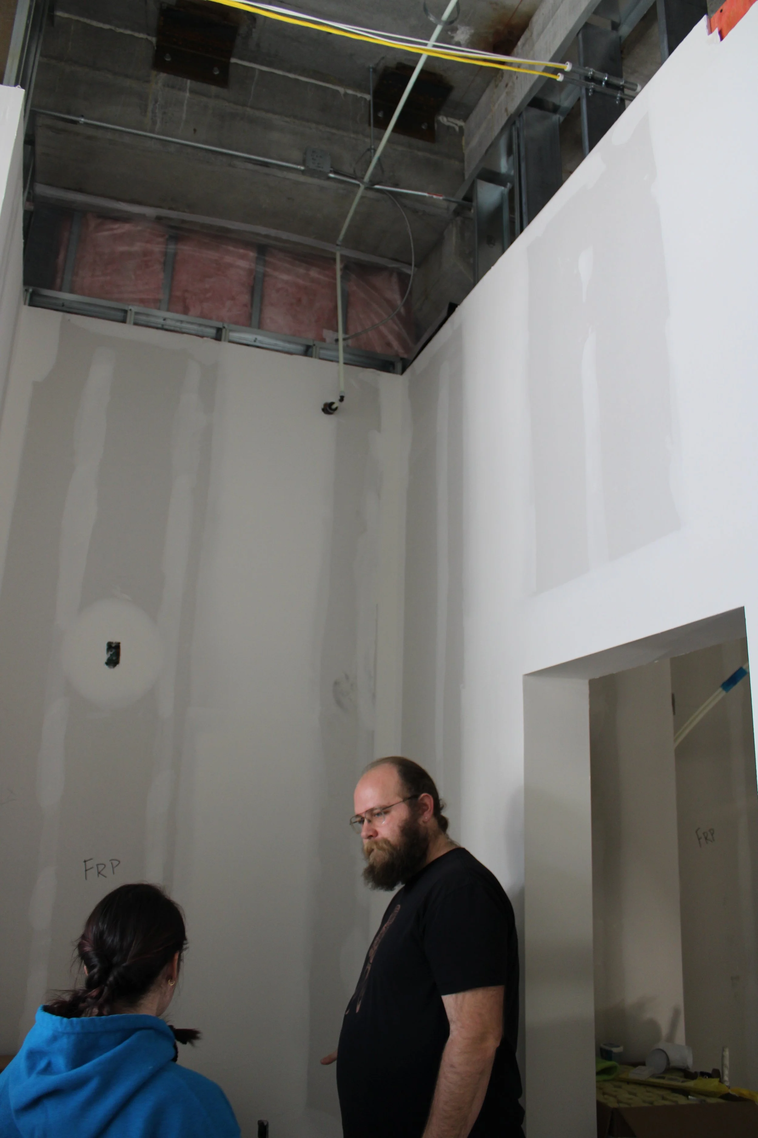 Quinn and lead barista tour the space