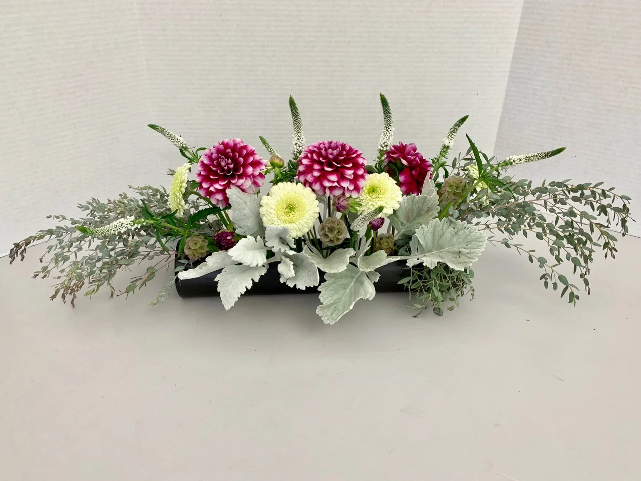Eucalyptus, dusty miller, dahlia, gerbera, veronica