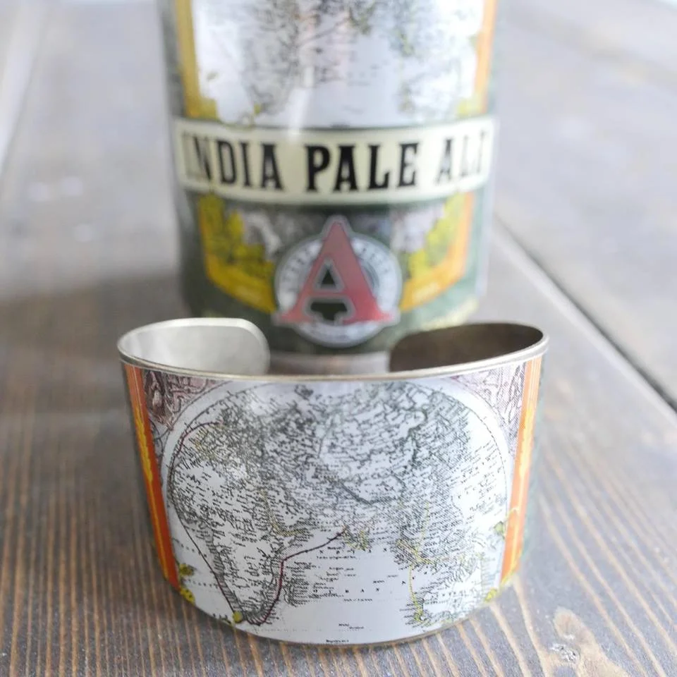 CRAFT BREWED JEWELRY “Inspired by the artwork on the ever growing supply of craft beer cans, I set out to redefine the way you think about trash. I started Craft Brewed Jewelry in 2015 combining my love of craft beer and design into eco-friendly and timeless accessories that coordinate with every day fashion. Craft Brewed Jewelry was created to highlight your favorite beverage in a beautiful way. Each piece is crafted with love and respect for the environment. It's my hope that through my work I can change the way others look at trash and see that there is beauty in the often overlooked and discarded."