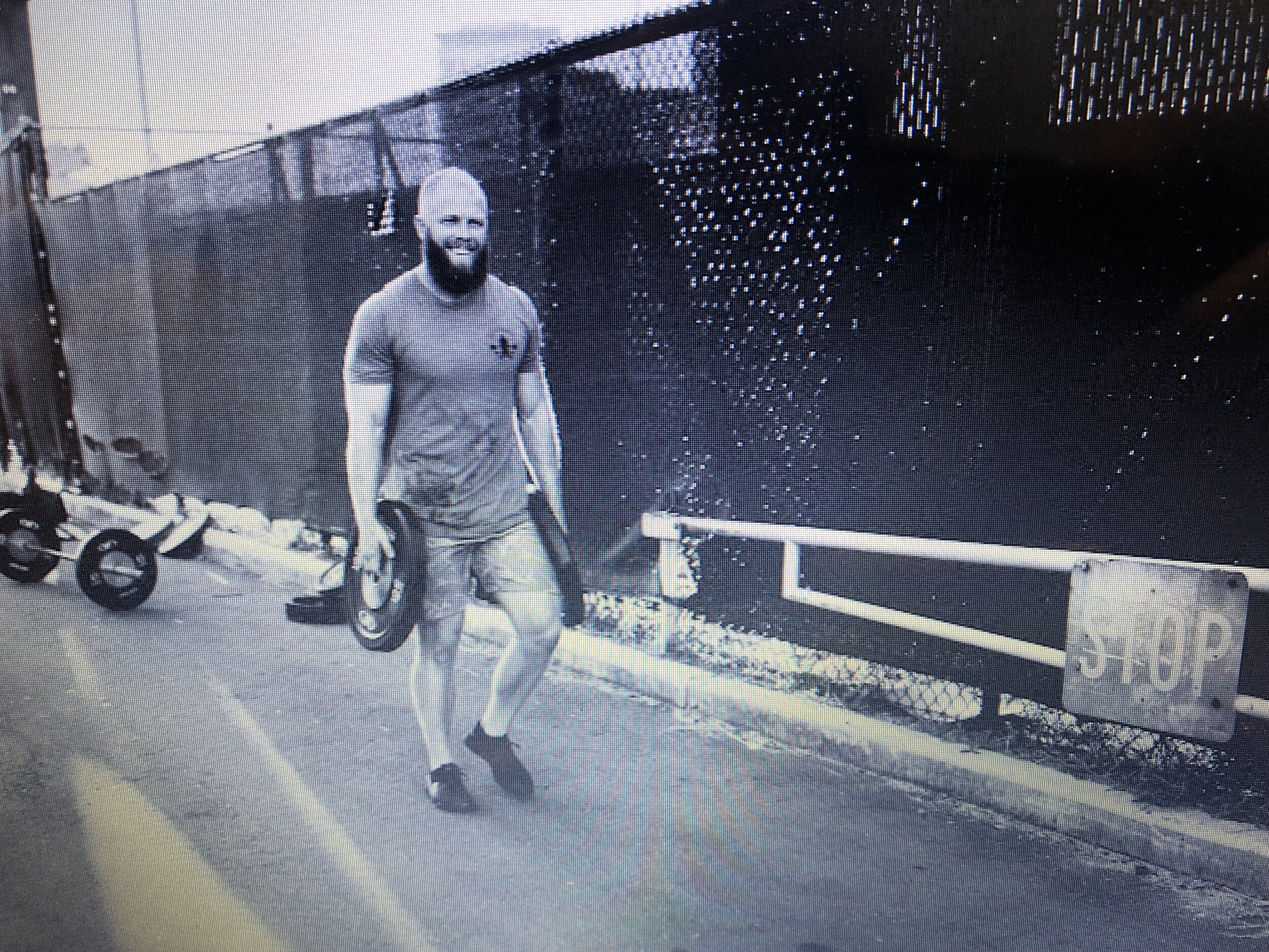 me carrying 2-45lb wts walking.jpg