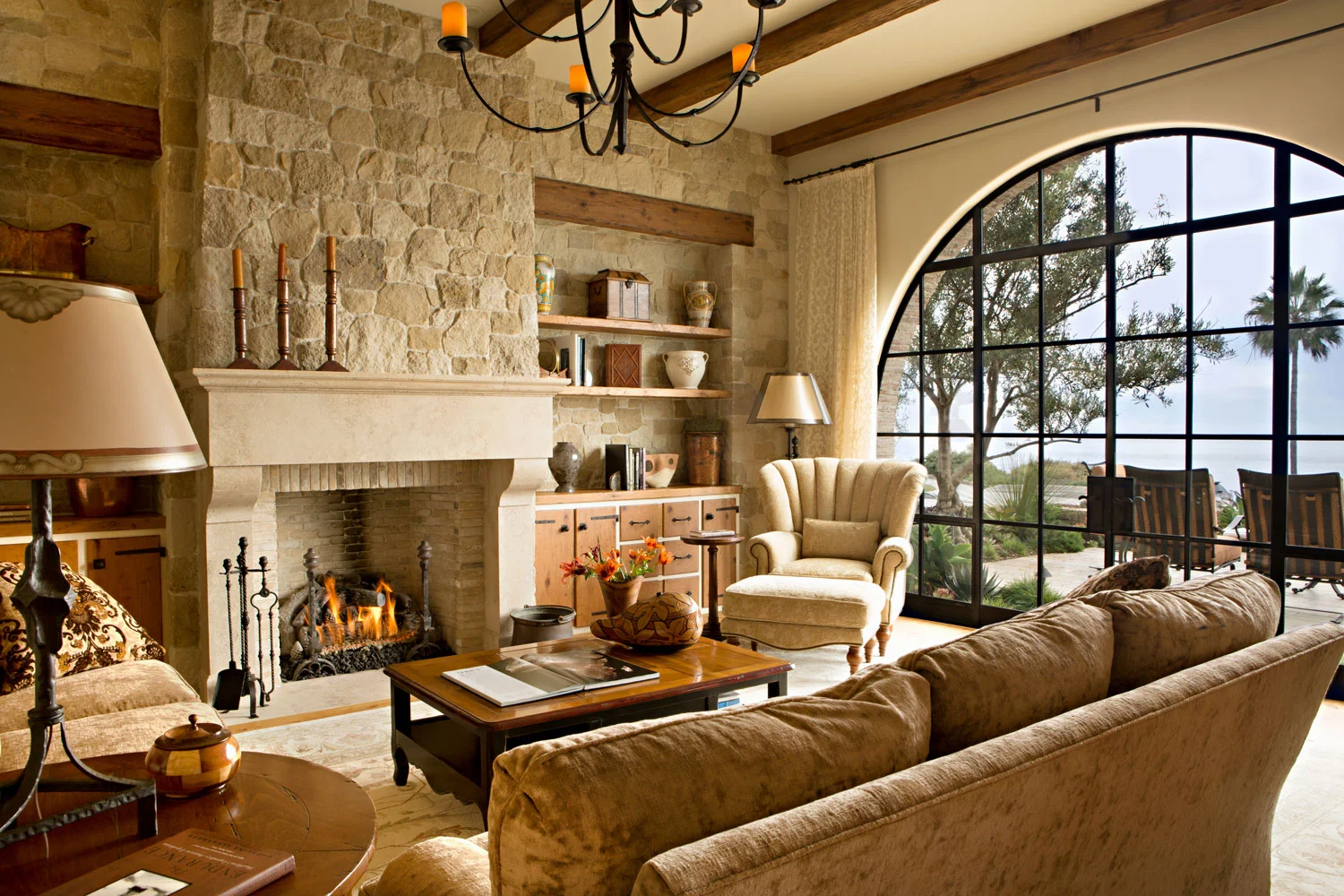 Mediterranean-Living-Room-Fireplace-Stone-Exposed-Beam-corbin-reeves.jpg
