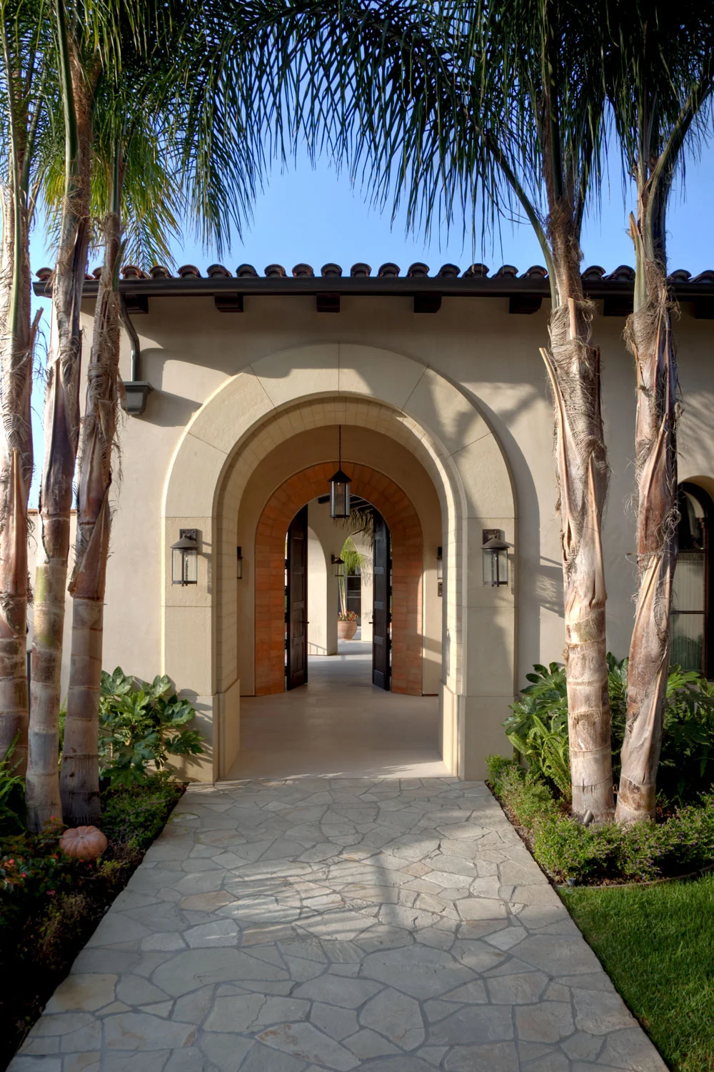 Contemporary-Spanish-Flagstone-Walkway-Arched-Doorway-Courtyard-Corbin-Reeves.jpg