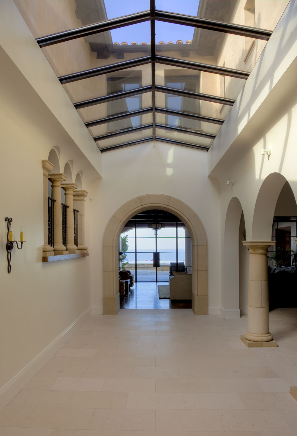 Modern-Spanish-Glass-Ceiling-Minimalist-Hallway-Stone-Archway-Corbin-Reeves.jpg