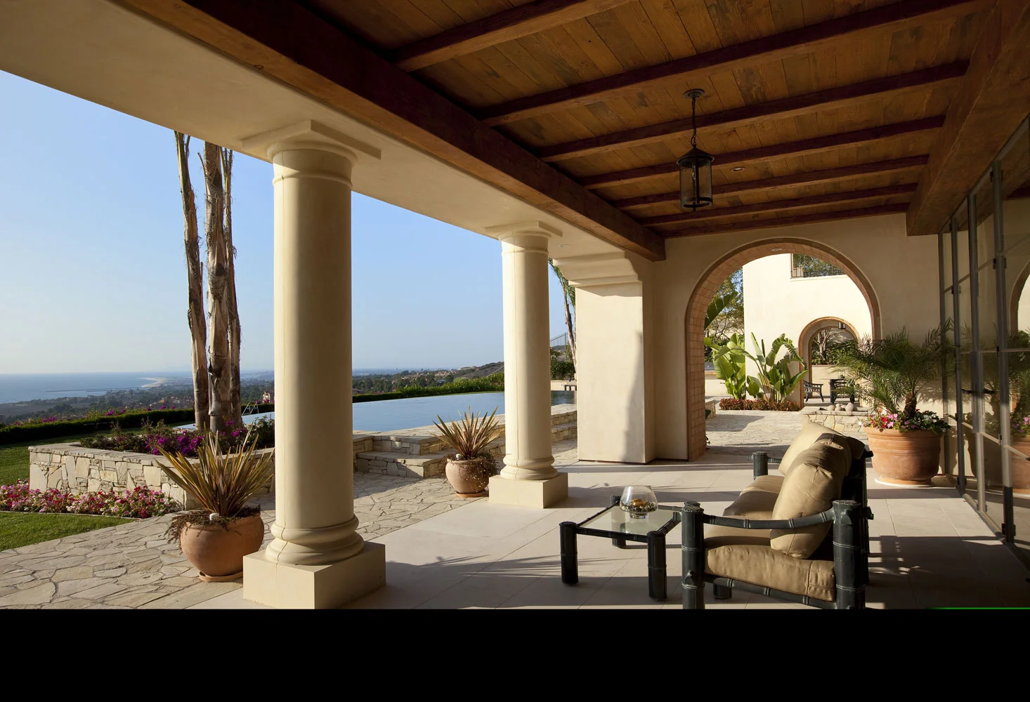 Modern-Spanish-Rear-Patio-Beamed-Tongue-Groove-Ceiling-Pillars-Views-Corbin-Reeves.jpg
