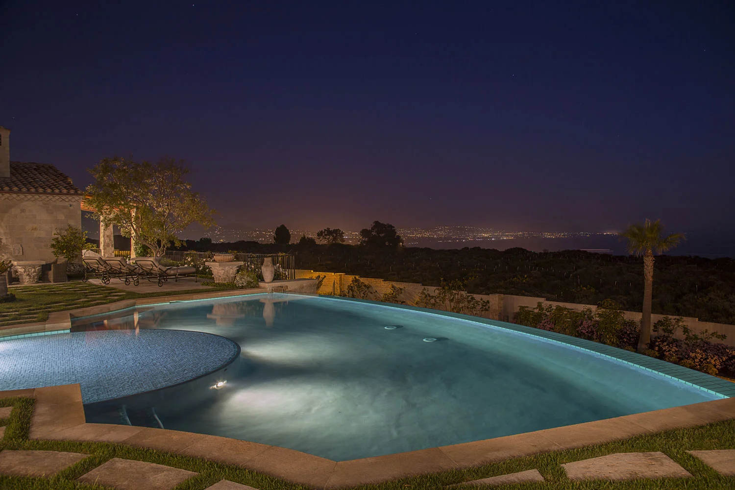 Rear-Yard-Pool-Views-Night-Mediterranean-Corbin-Reeves.jpg
