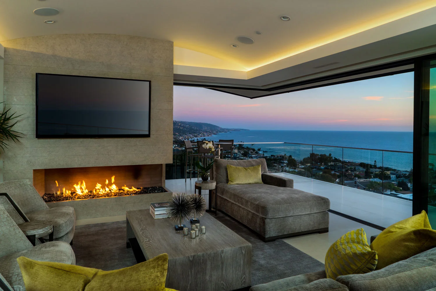 Contemporary-Living-Room-Fireplace-Retractable-Doors-Ocean-Views-Corbin-Reeves.jpg