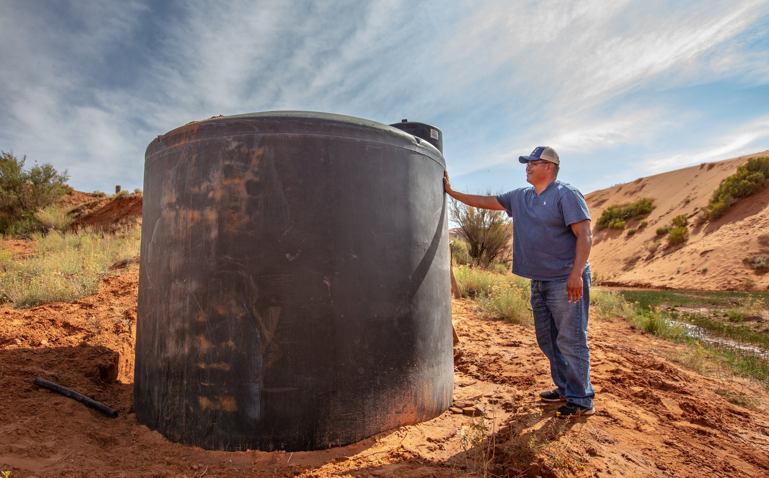  Ph.D. Post Doctoral Researcher and local Tommy Rock gives us a tour of one of two water collection tanks he maintains and samples in the Monument Valley Navajo Tribal Park. Rock’s work focuses on the identification, monitoring and communication of e