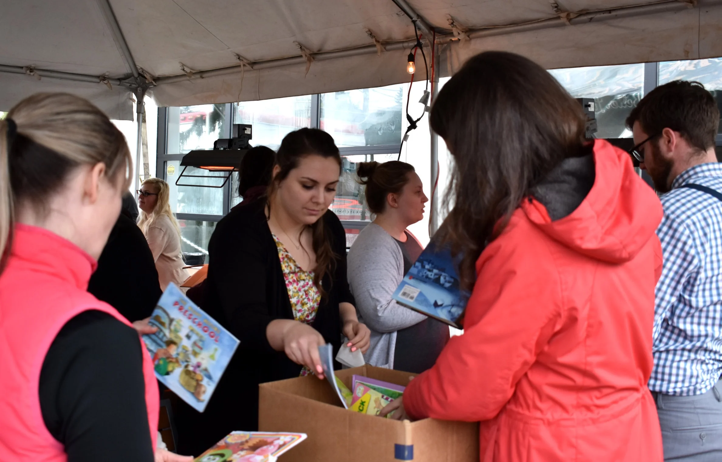 Emerging Leaders sorting and cleaning books during 2018 BookFest.
