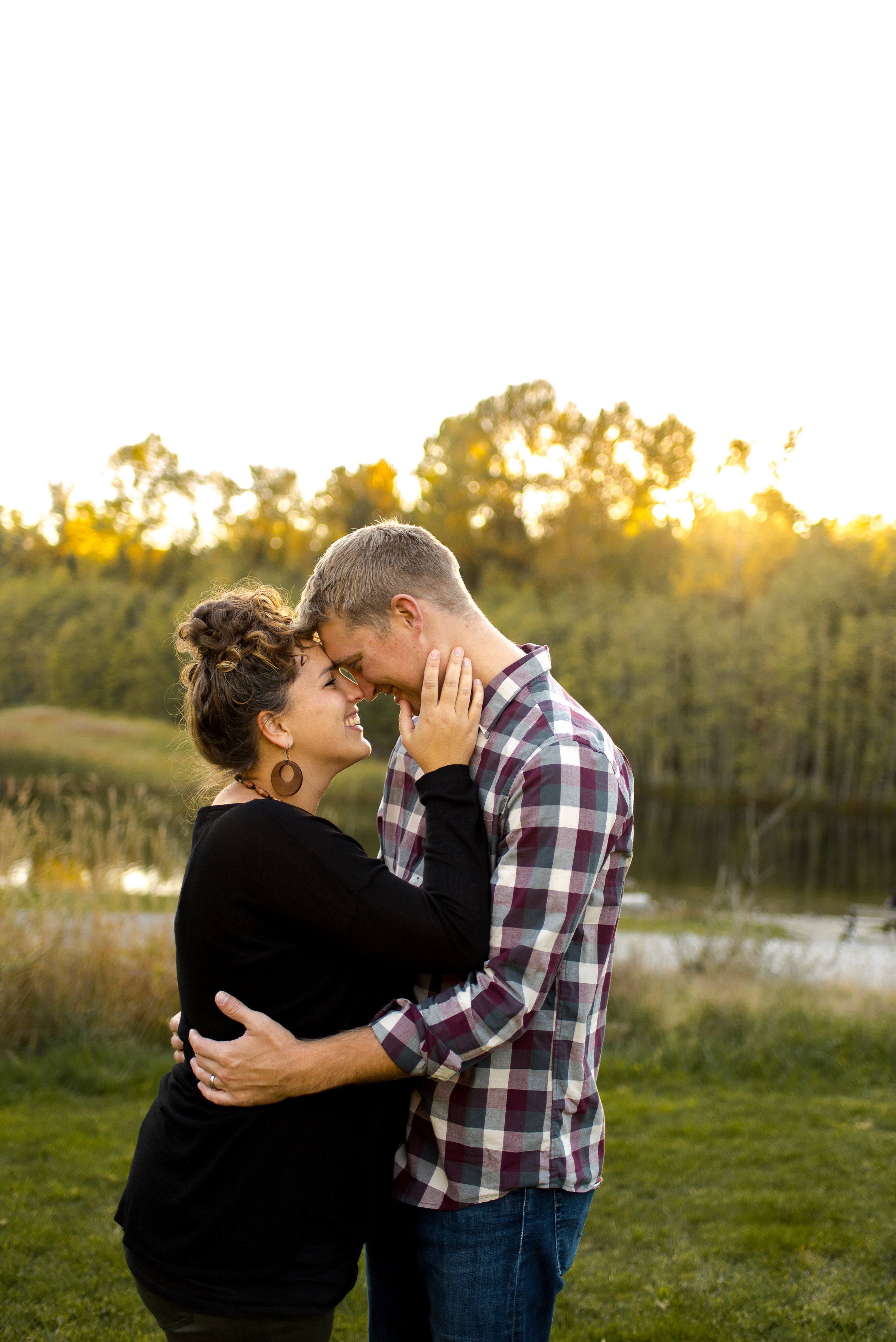 Couple hugging during their family session in Green Timbers Park in Surrey BC