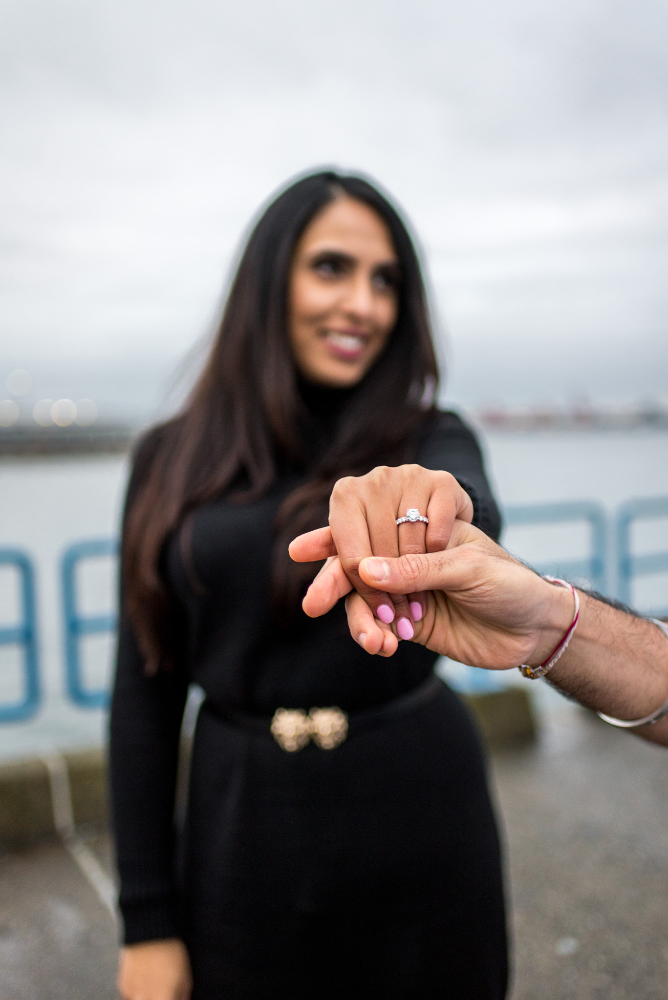 Engaged bride shows off ring to camera