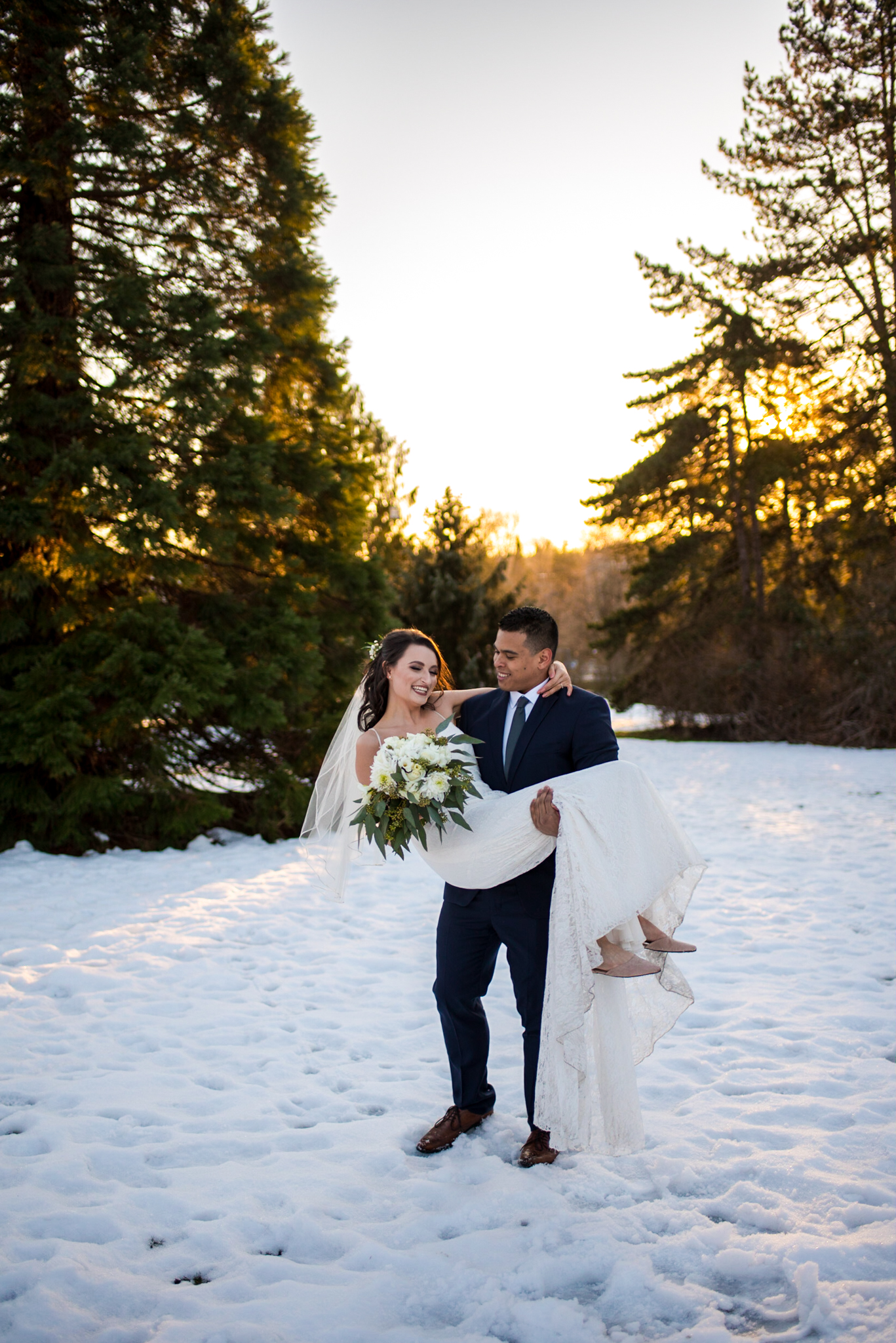 Bride and Groom in the snow at Queen Elizabeth Park