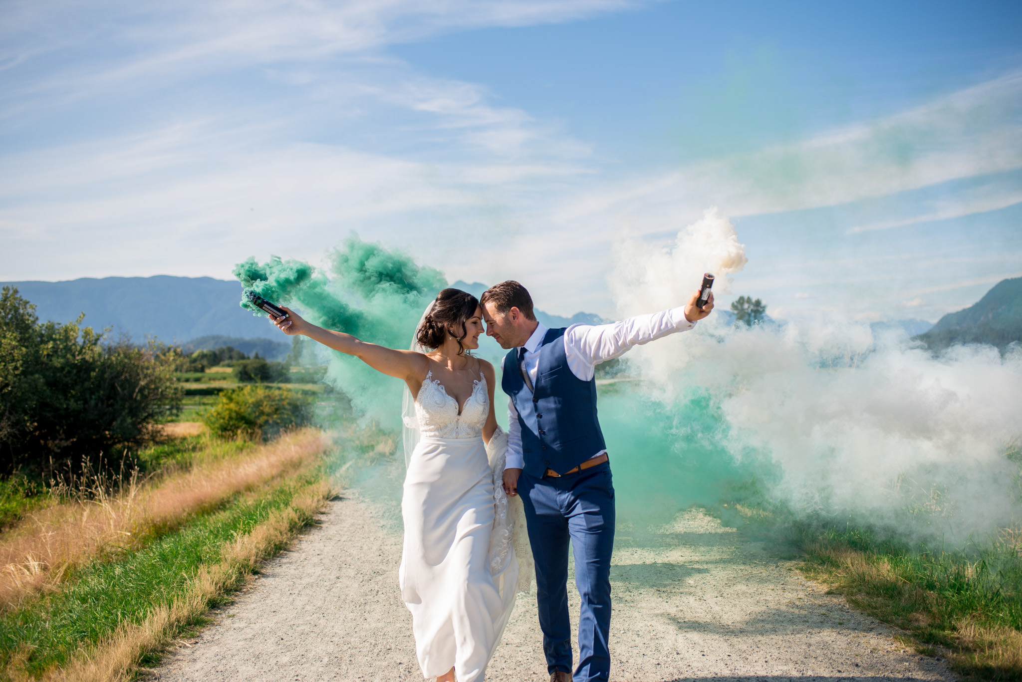 Wedding Couple with smoke bombs walking in Jerry Sulina Park, Maple Ridge BC