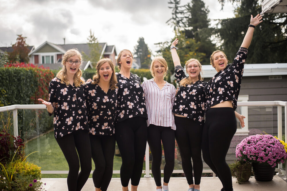 Bride and Bridesmaids cheering while getting ready outside in New Westminster, B.C.