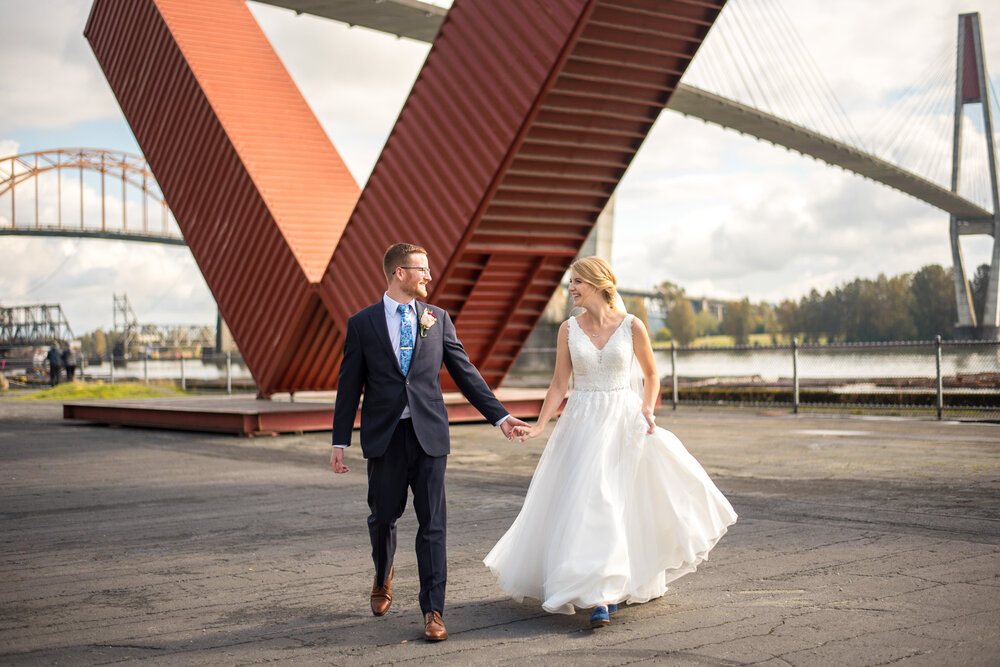 Bride and Groom running at Pier Park in New Westminster, BC.