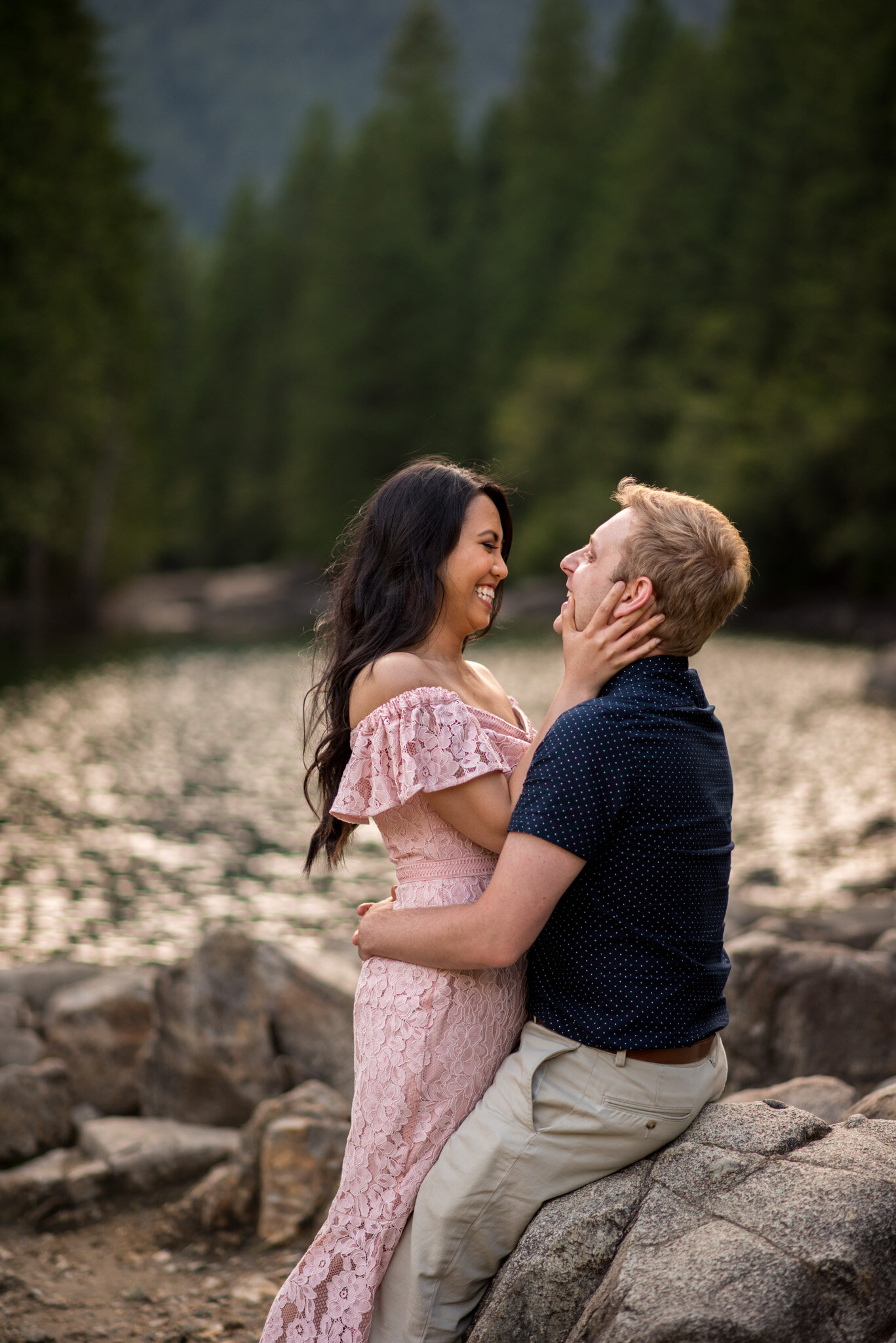 A couple cuddling during their engagement session at North Beach at the end of Gold Creek in Golden Ears Provincial Park at Maple Ridge, B.C.