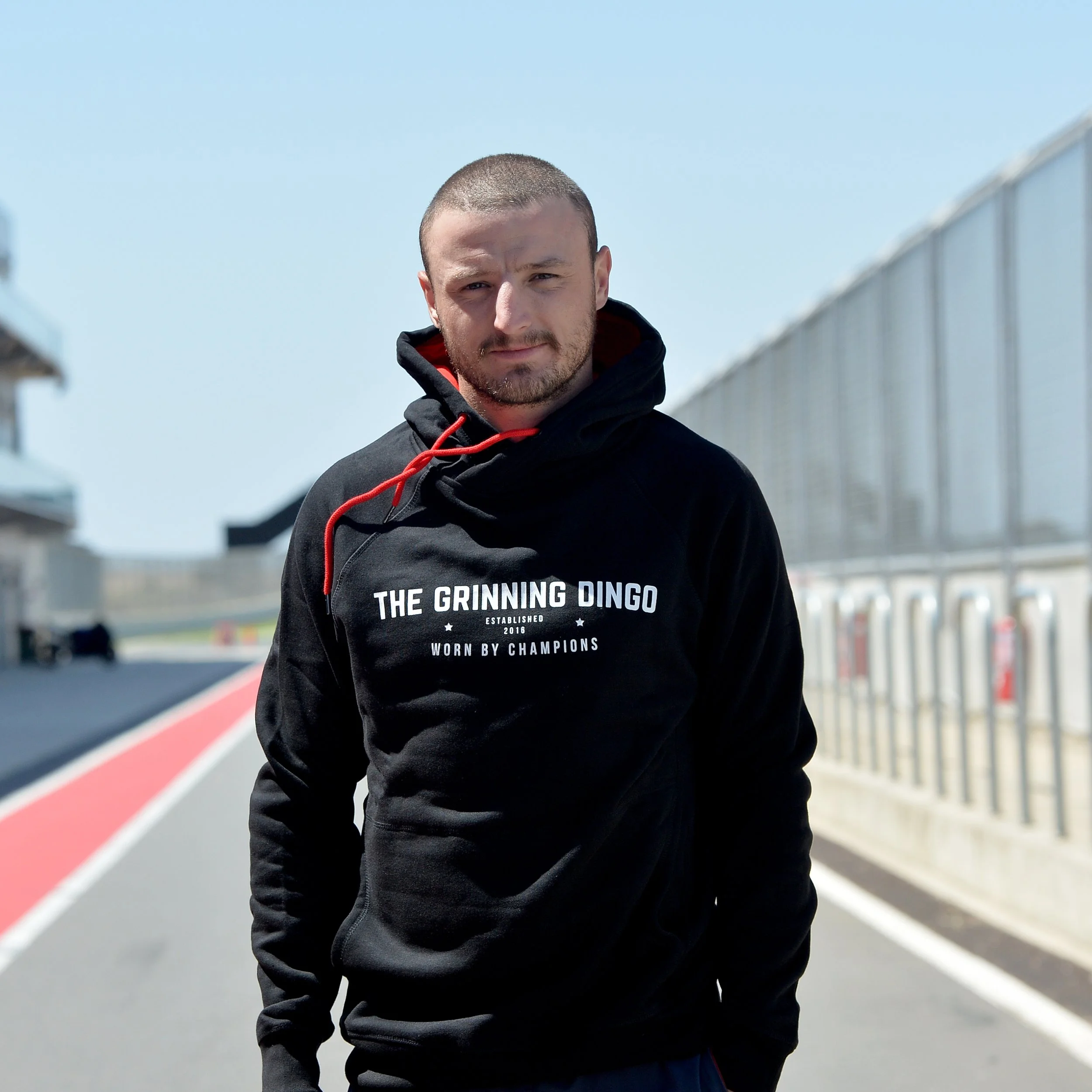 THe Grinning Dingo Champions Hoodie in Black