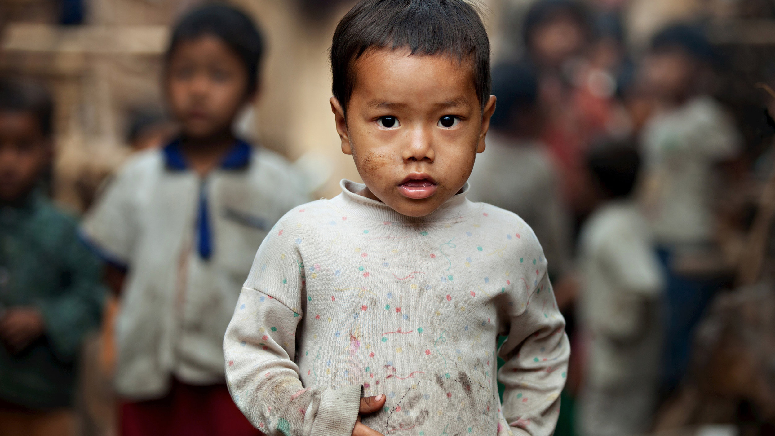  Boy in alley in Burma.  Photo courtesy Silent Images  