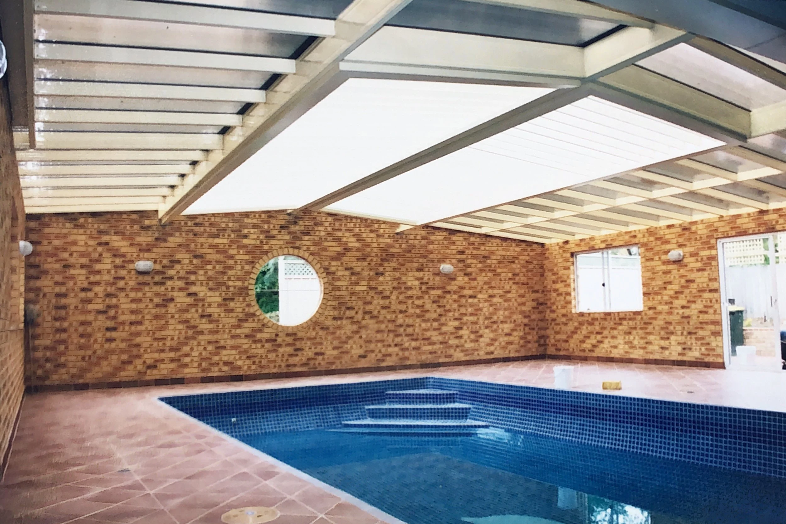 vergola over pool with laserlite.jpg