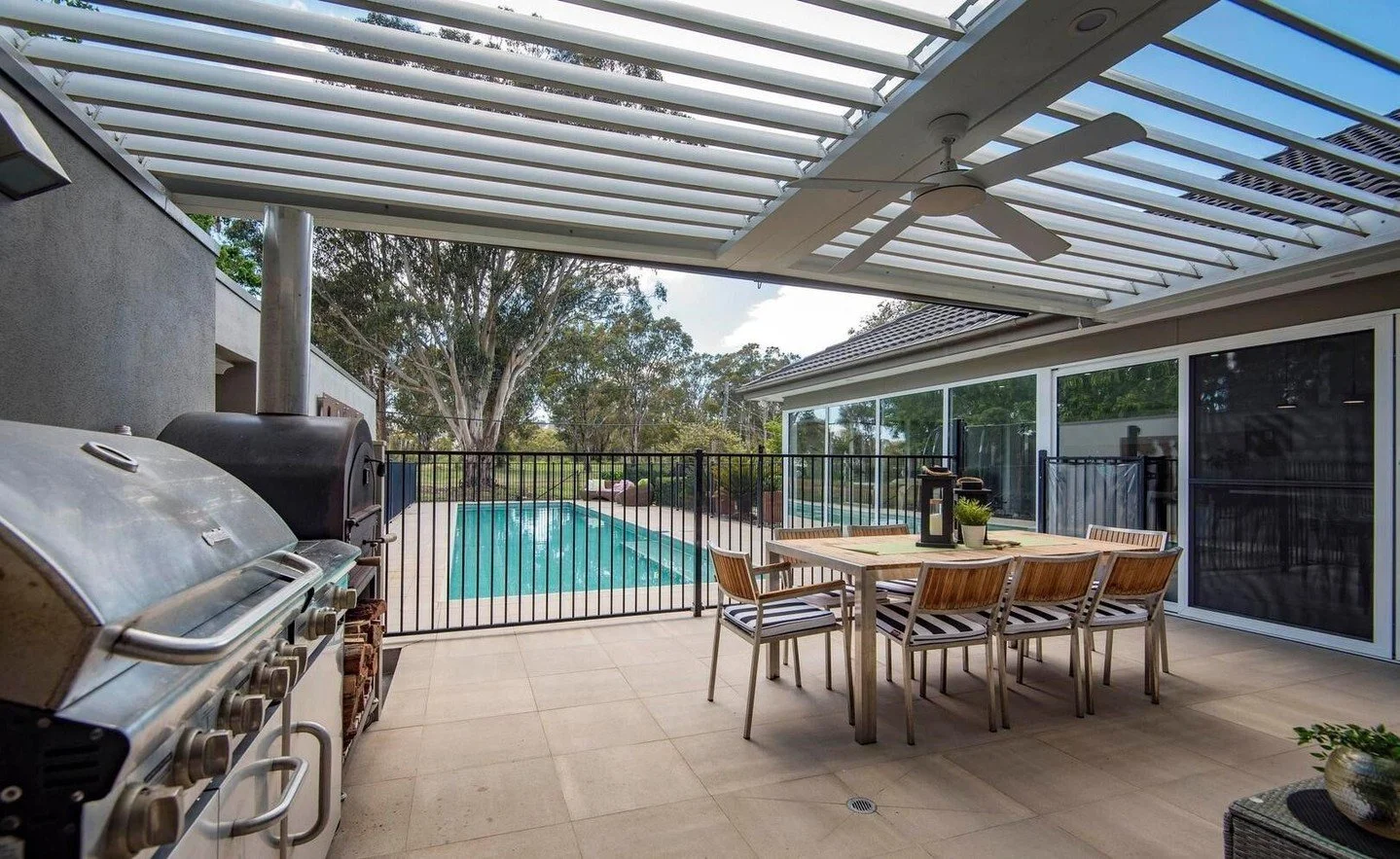 Outdoor living, elevated.

With a custom Vergola overhead, this poolside entertaining area is ready for anything &mdash; bright sunshine, summer heat, or cool evening breezes. Adjustable louvres let you control light, shade and airflow at the touch o