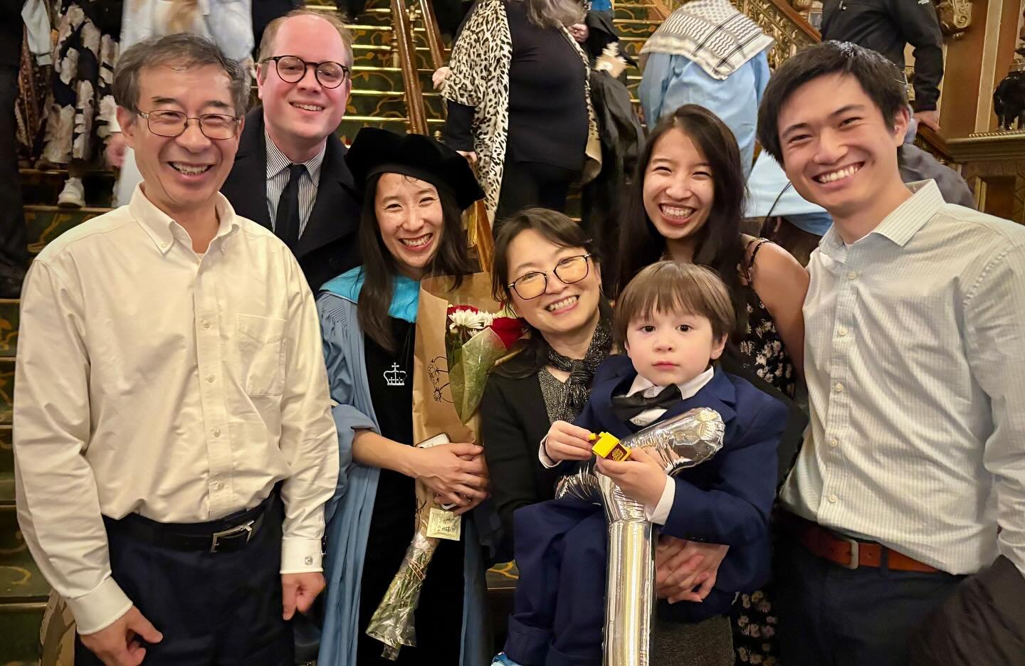 A final graduation photo with the family and a few moments from the hooding on stage with my dissertation advisor Dr Haeny Yoon! Niki was so ready to leave after a very long day—understandable! We had a shared moment on stage that was… l