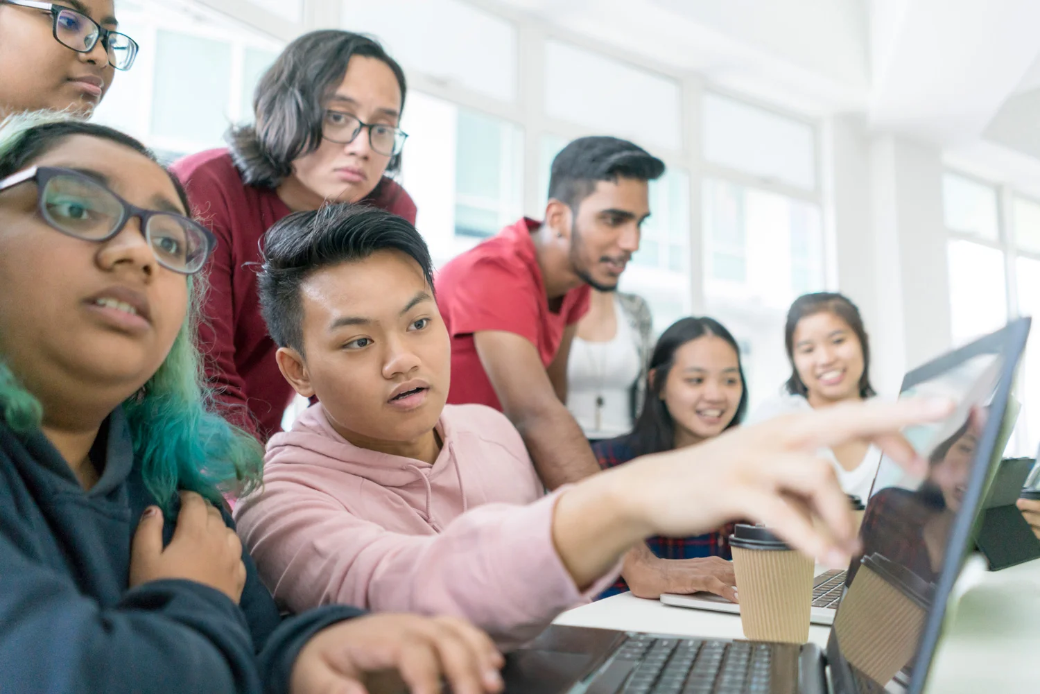 students-surrounding-computer.jpg