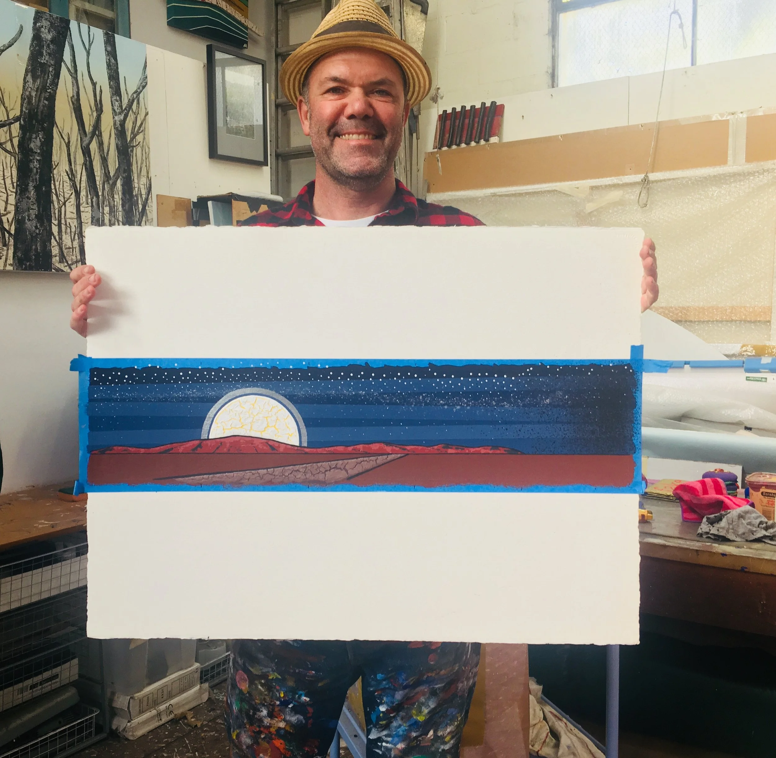 Collaborator and celebrated artist Blak Douglas with the original artwork created for the audience gift booklet as part of MWTIN engagement strategy 