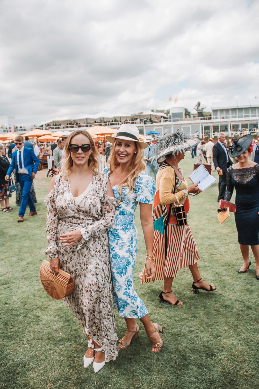 With my sister Lucy and a v chic lady in the background who showed far more commitment to the hat cause