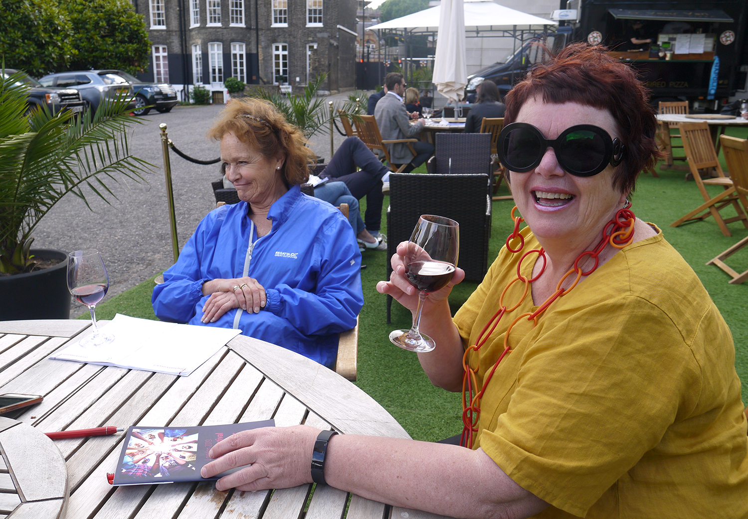A good glass of wine and some stylish Prada sunglasses: now that’s class!
