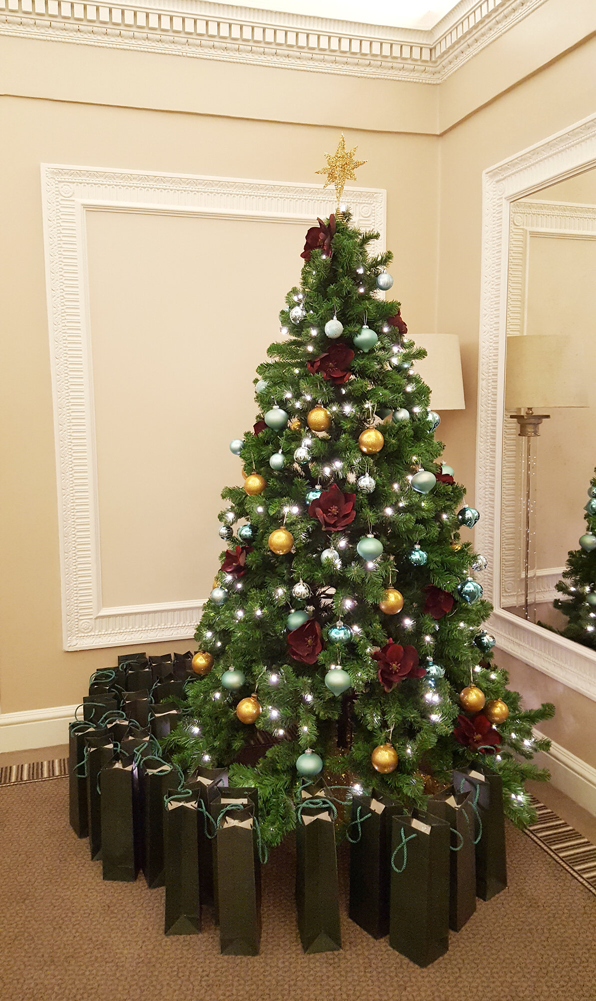  Our kind of gifts under the Christmas tree: goodie bags lined up and ready, each containing a delicious bottle of Champagne! 