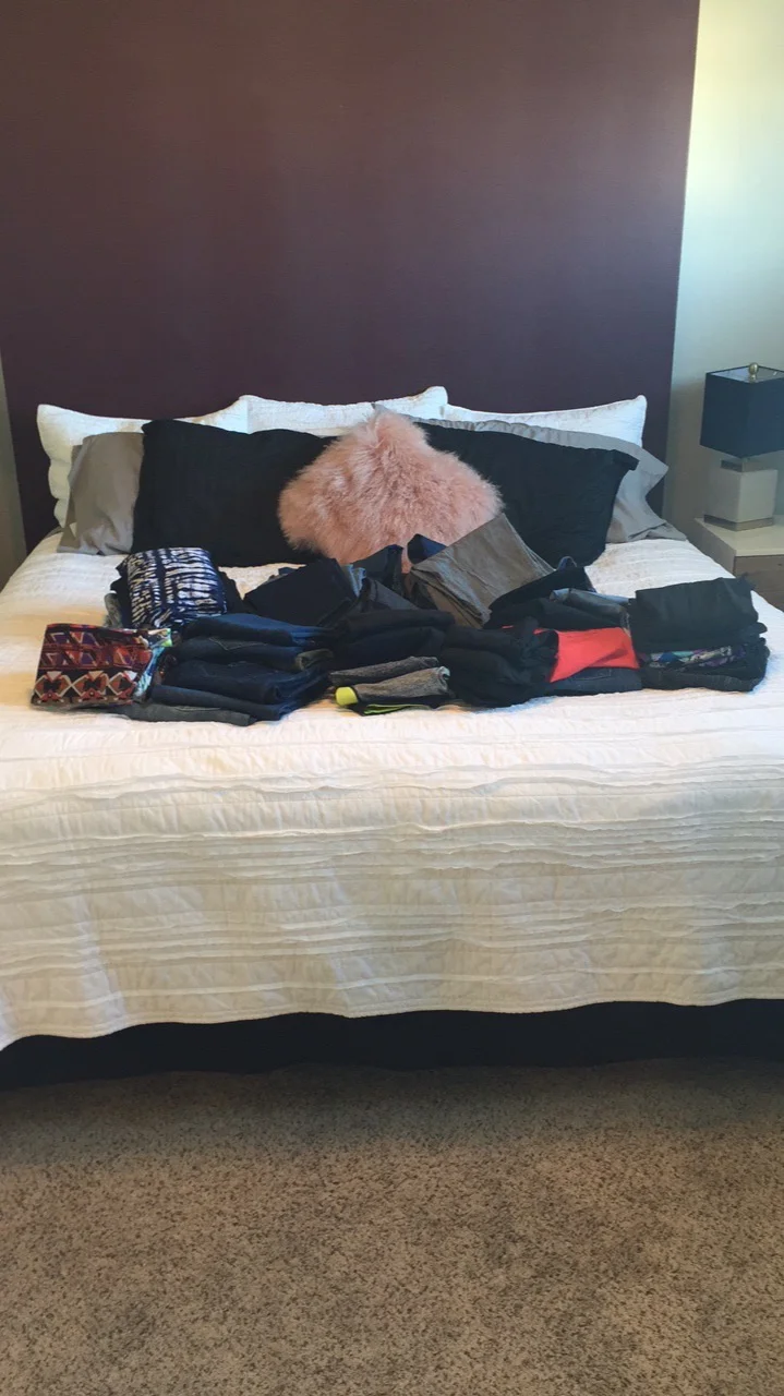 DURING - We took everything out of her closet in sections. These are all of my client’s yoga pants. My client picked up each piece of clothing and asked herself “Does this item spark joy”? If it did, she kept it. If it did not, we put it in a pile for donations.