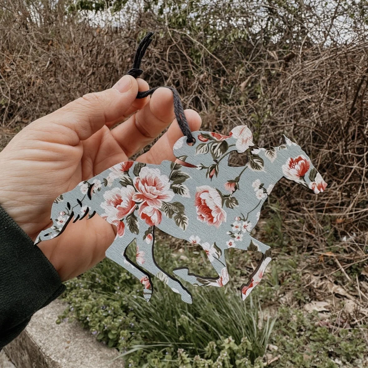wooden racehorse with jockey ornament with floral pattern