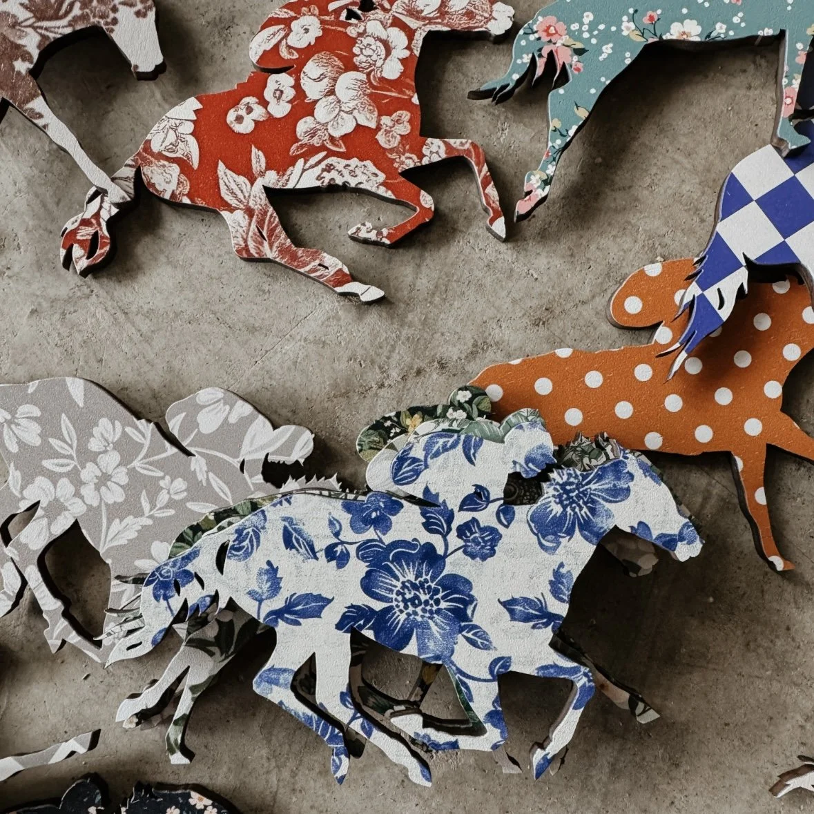 wooden racehorse with jockey ornament with floral pattern