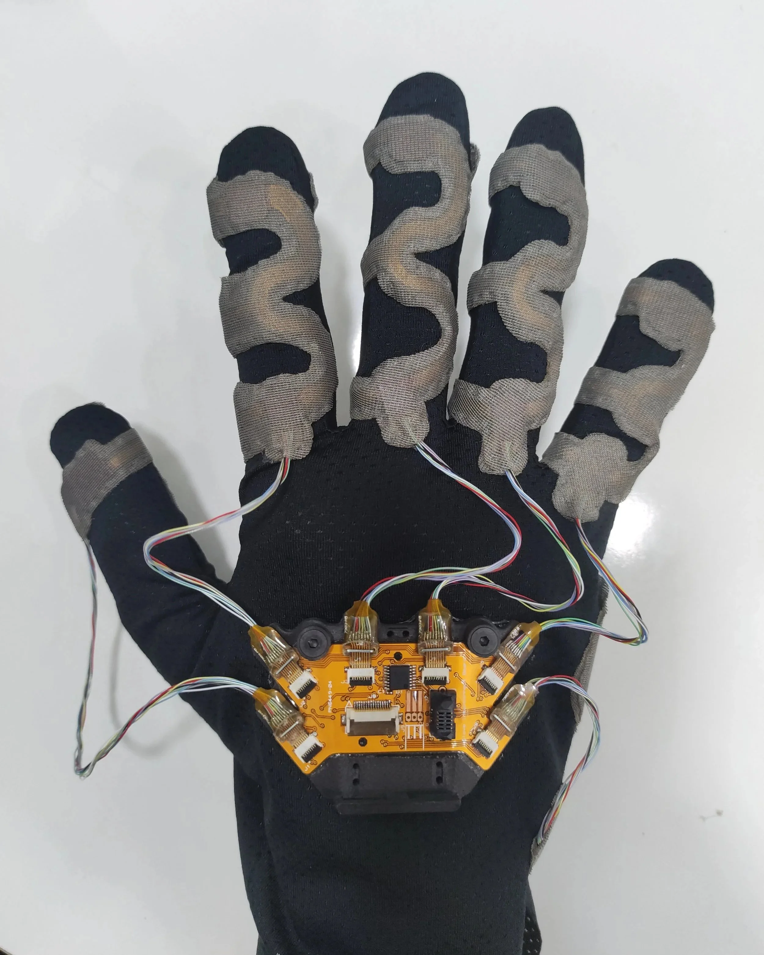 Ten Years of Engineering Lessons from the TactileGlove