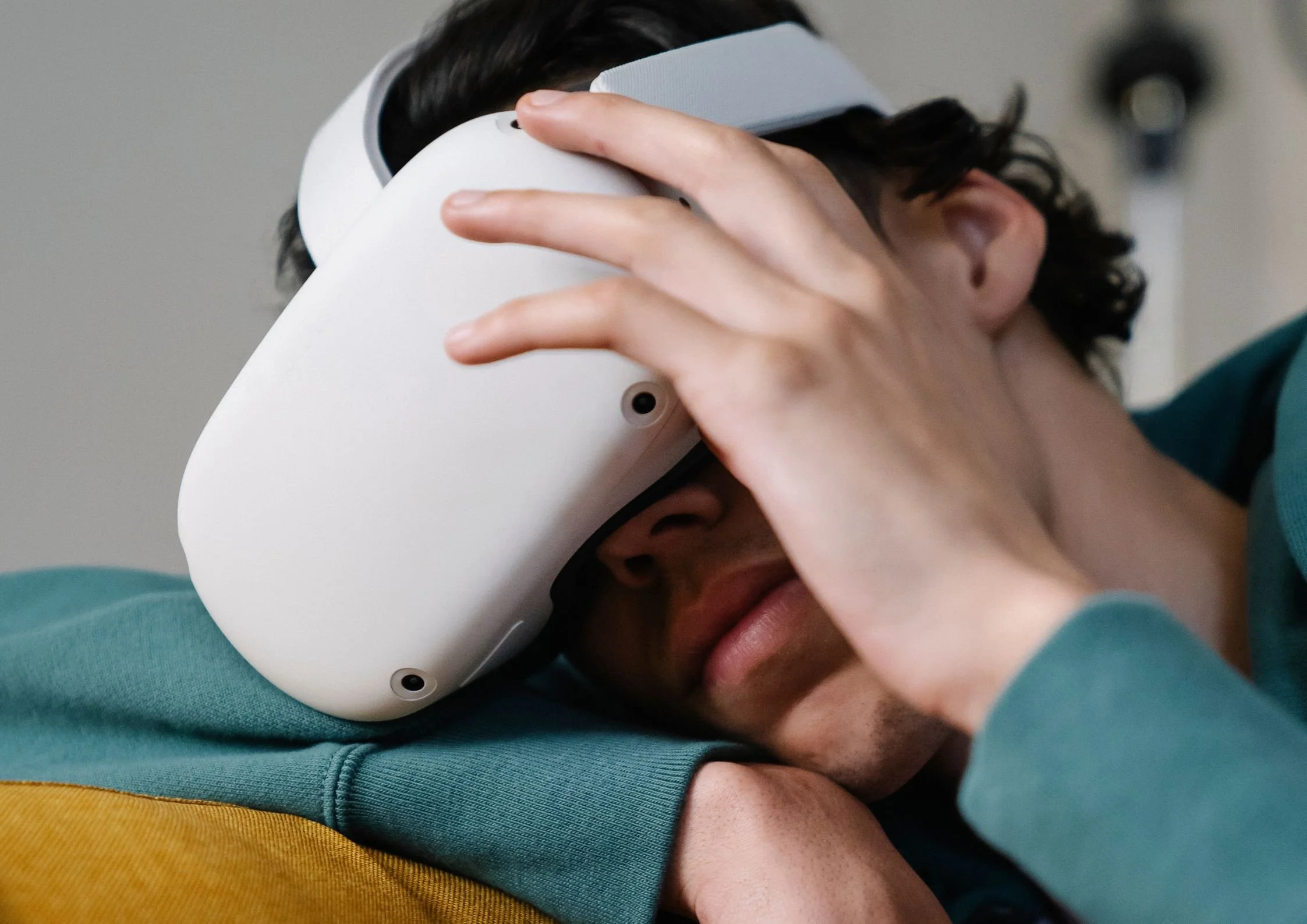 Person wearing a virtual reality headset, illustrating the importance of comfort, fit, and pressure distribution in wearable product design.