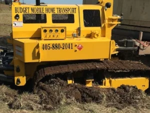 Moving mobile homes sometimes requires a remote trax called the house cat. It can get your manufactured home through tight places that trucks can't.